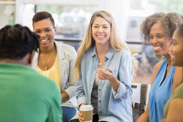 istock Woman gives humorous advice in support group 1051247468