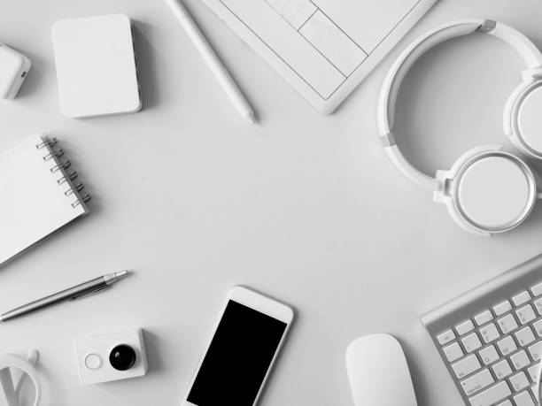 istock top view of office desk workspace with notebook, graphic tablet, smartphone and gadget on table background, graphic designer, Creative Designer concept. 1051248088