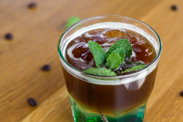 istock Cold coffee with mint leaves and ice cubes on the bar 1051248414