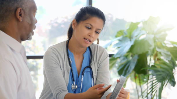 istock Healthcare professionals discuss a patient's diagnosis 1051248524