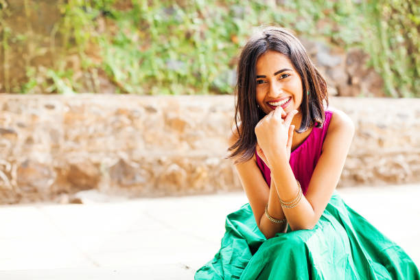 Happy indian woman looking at camera and smiling