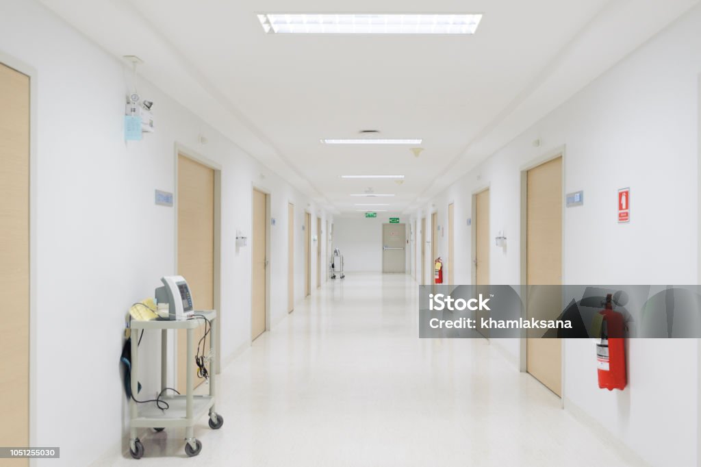 Vital signs patient monitor and fire extinguisher placed on corridor of the hospital. Hospital Stock Photo