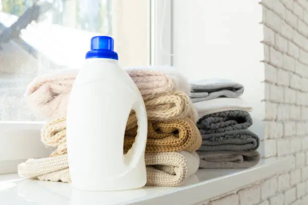 Photo of pure clothes with washing-up liquid