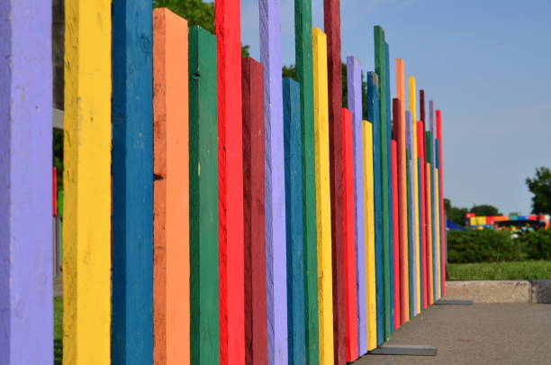 istock Colorful painted wooden fence, angled view 1051258696