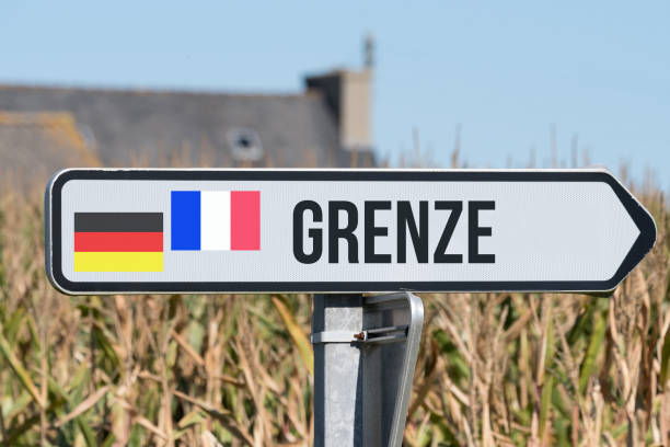 A sign indicates the border between Germany and France