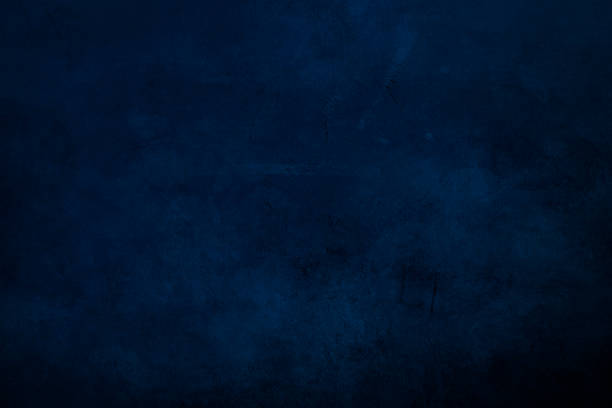 istock DArk blue  grungy canvas background or texture with dark vignette borders 1051267914