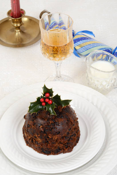 istock traditional christmas pudding with glass of wine 1051271038