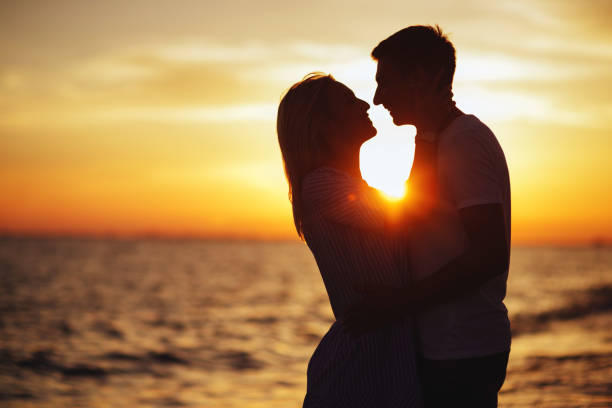 istock Young happy couple on seashore. 1051273192