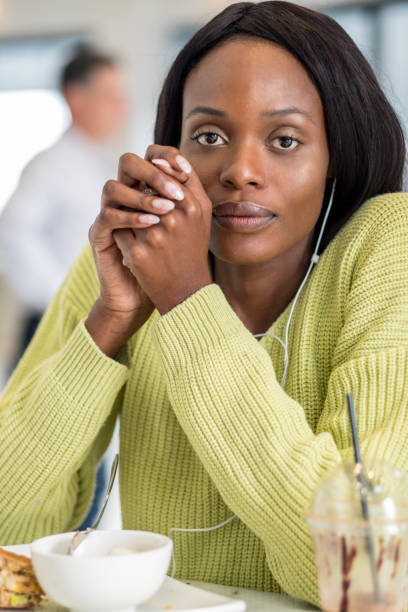 istock Young black woman at lunch 1051281560