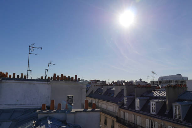 istock The roofs of Paris and its chimneys under a clouds sky 1051282012