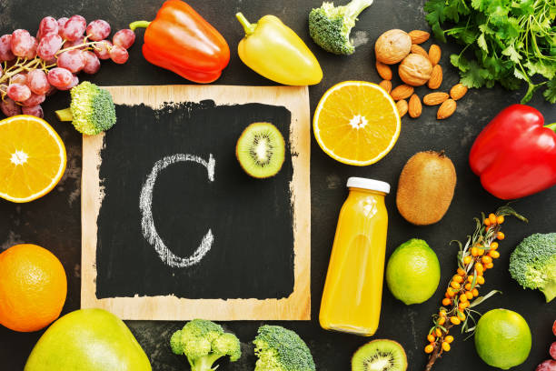 istock Foods high in vitamin C on a stone black rustic background. Top view,flat lay. 1051282394