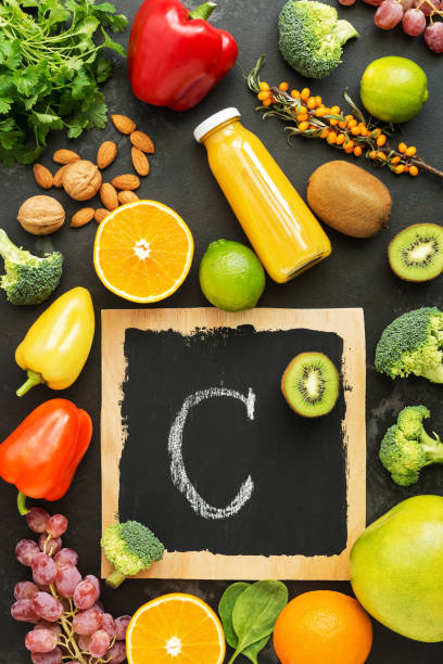 istock Foods high in vitamin C on a stone black rustic background. Top view,flat lay. 1051282494