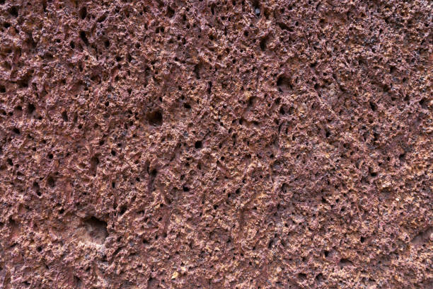 istock background of red laterite stone wall texture 1051283526
