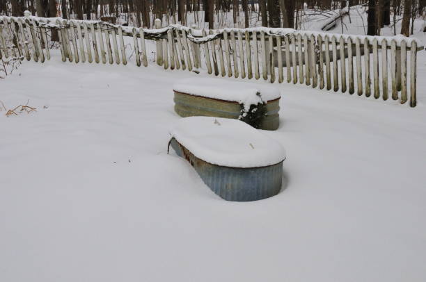 istock Water Troughs Used as Flower Planters, in Winter 1051283842
