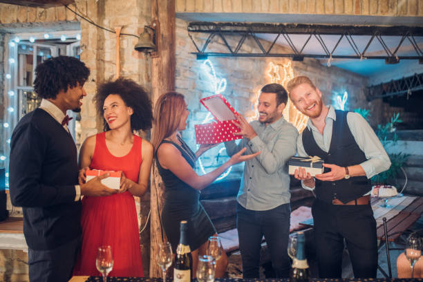 istock Happy people holding gifts 1051284106
