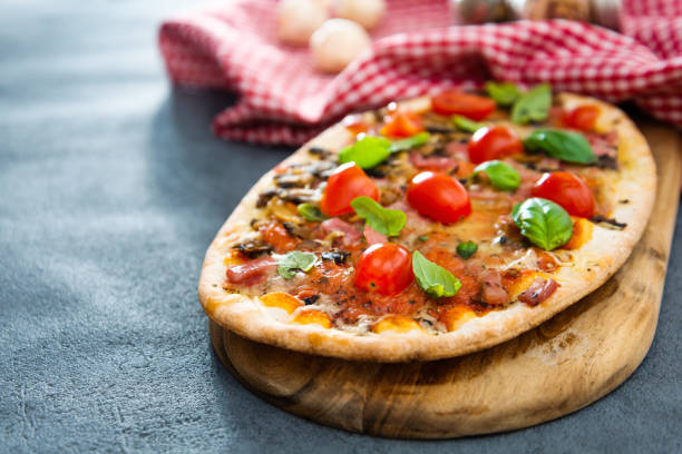 istock Pizza with Ham and Mushrooms 1051288308