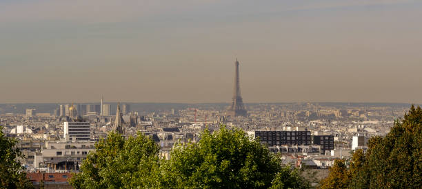 istock Pollution in Paris, aerial view of Eiffel Tower with smog in bac 1051288328