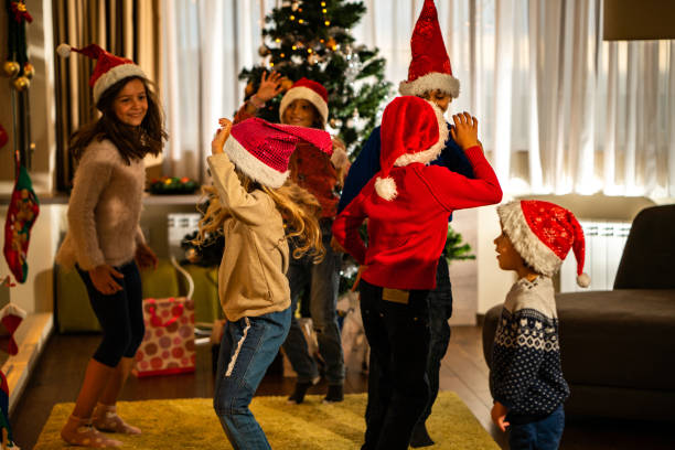 istock Excited children dancing at Christmas Eve 1051289426