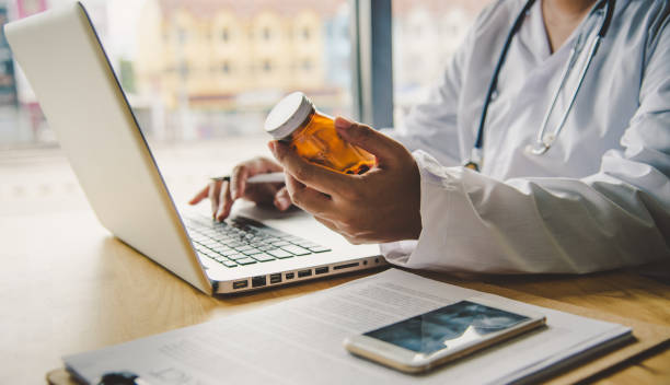 istock Physician information about the medicine by the lab. 1051292616