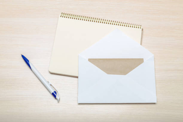 istock Photo of blank envelope on a  wooden background 1051293222