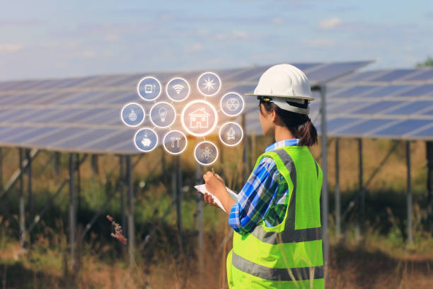 istock young woman engineer checking solar panel with hologram at solar power plant 1051293318