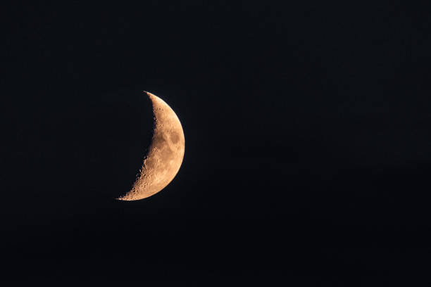 istock Half Moon close up. Astronomical body. Black deep cosmos space background. Copy space 1051293538