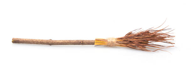 istock A witch's broomstick laying on a white floor. Studio photo with Halloween in mind. 1051294964