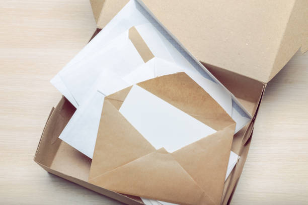 istock Photo of blank envelope on a  wooden background 1051294986