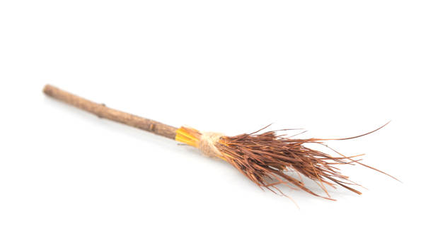 istock A witch's broomstick laying on a white floor. Studio photo with Halloween in mind. 1051297280