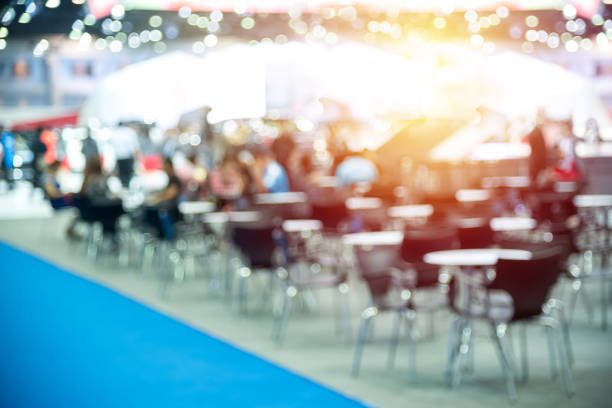 istock Defocused Image Of People Sitting At Poolside 1051302872