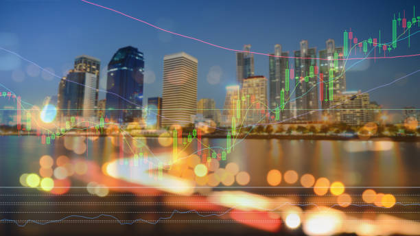 istock Digital Composite Image Of Graph With Illuminated Buildings In City At Night 1051303210