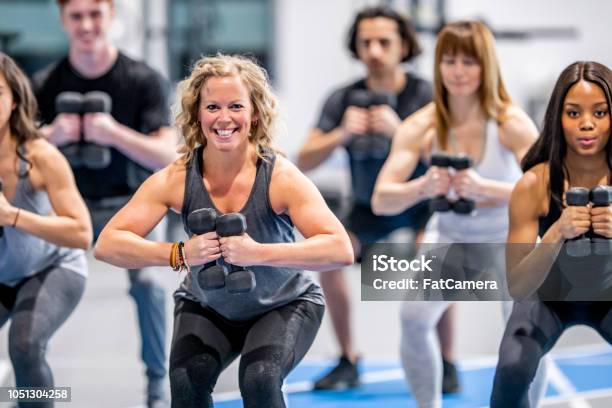 Doing Exercises Together Stock Photo - Download Image Now - Exercising, Group Of People, Exercise Class