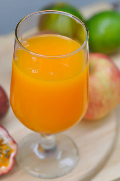 istock orange juice or passion fruit juice 1051304844