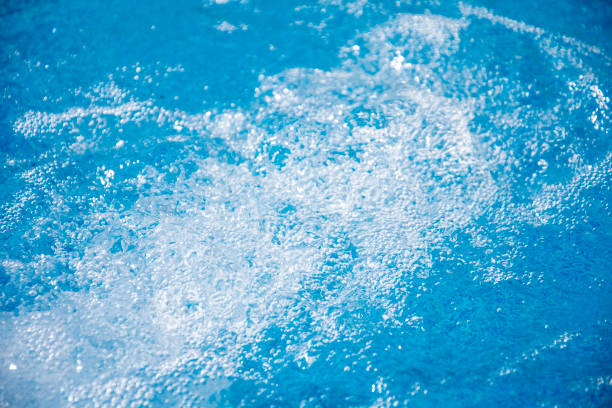 istock Blue clear fresh Water in hot tub. Spa massage background. 1051304936