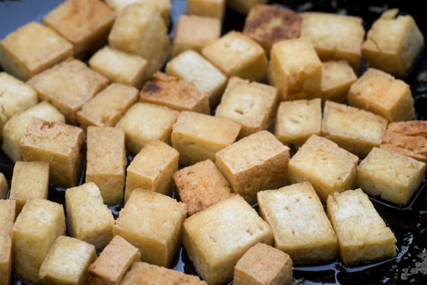 istock tofu cubes fried in wok 1051313670