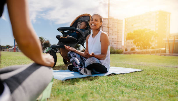 istock Woman doing yoga sitting in park 1051313970