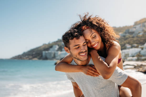 istock Romantic couple having fun at the beach 1051317066