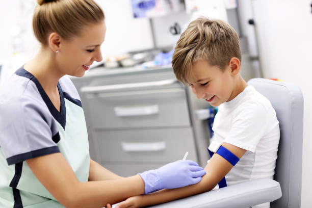istock Brave little boy having blood collection for tests 1051318870