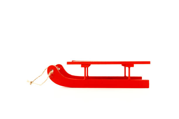 istock Wooden Sledge in Red with Rope isolated on White 1051319356