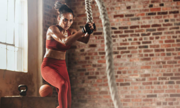 istock Woman exercising hard for perfect body 1051319990