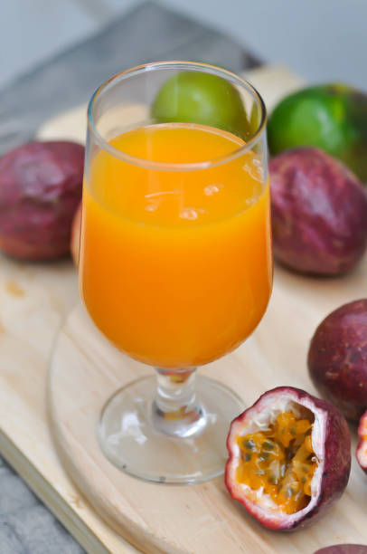 istock orange juice or passion fruit juice 1051323302