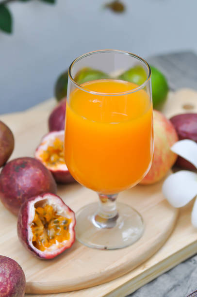 istock orange juice or passion fruit juice 1051323304