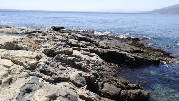 istock Landscape of rock formations and rocky beach 1051323848