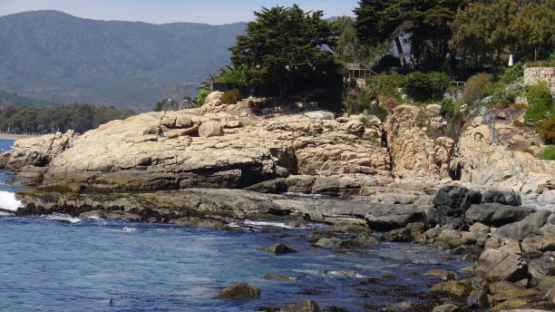 istock Landscape of rock formations and rocky beach 1051323998
