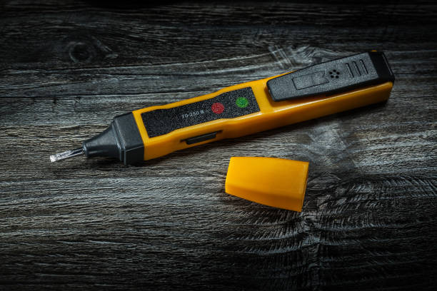 istock Electric tester on wooden board top view 1051327506