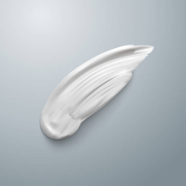 istock White cream element mockup. Realistic cosmetic concealer brush stroke isolated. Cream smear. Stock Vector illustration EPS10. Top view 1051328650