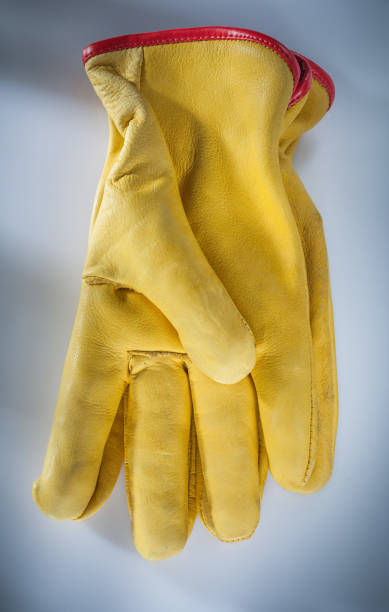 istock Leather safety gloves on white background 1051331826
