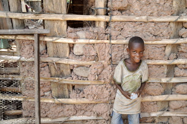 istock Portrait Of Smiling Boy Standing Against Wall 1051333668