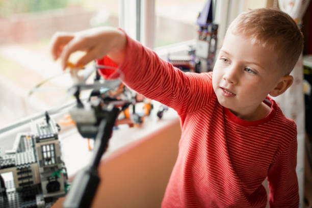 istock Little Boy Playing with Toys 1051337624