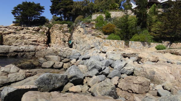 istock Landscape of rock formations and rocky beach 1051344418